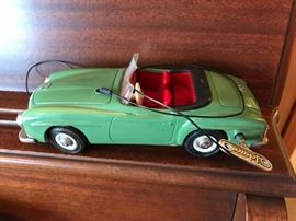 #126	Schuco Green German Metal car w/key 	 $75.00 
