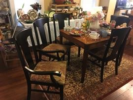 There are six of these dining chairs, 4 straight back and 2 with arms