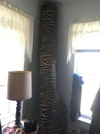Large beige and black zebra strip rug