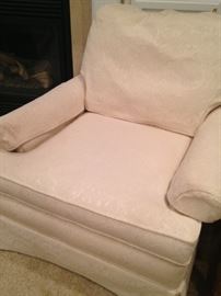 One of two white chairs