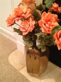 Brass container of roses