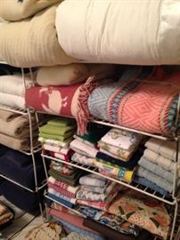 Assorted blankets, towels, and dish cloths