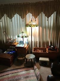 Stained glass lamps, antique hand made braided rugs, several trunks of various sizes
