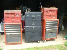 Many roll away tool boxes including Craftsman