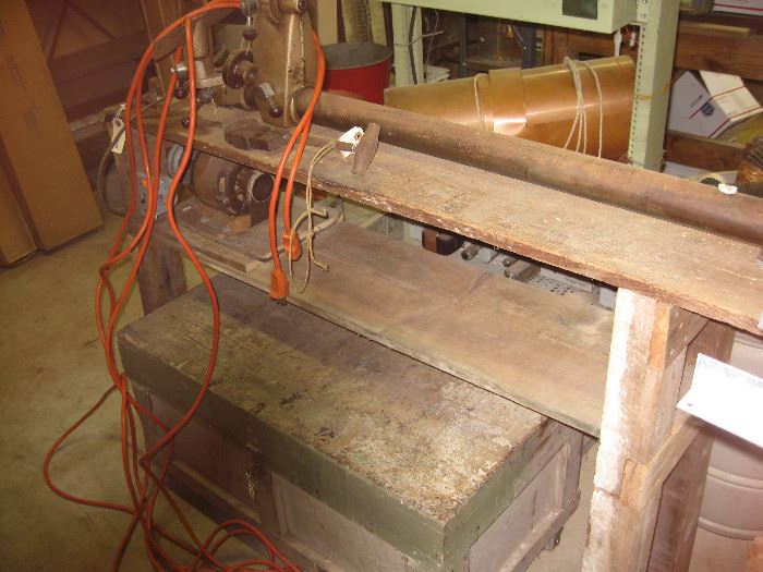 A large antique tool chest with tray and saw storage.