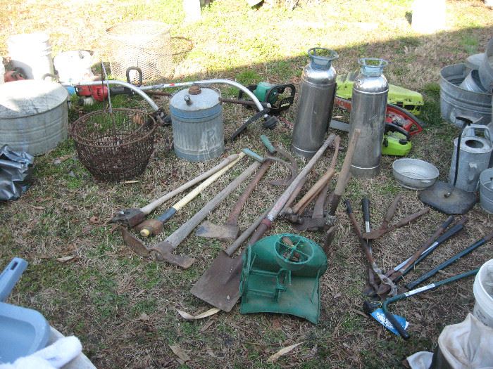 Axes, hatchets, wire baskets, old fire extinguishers, and more galvanized containers...