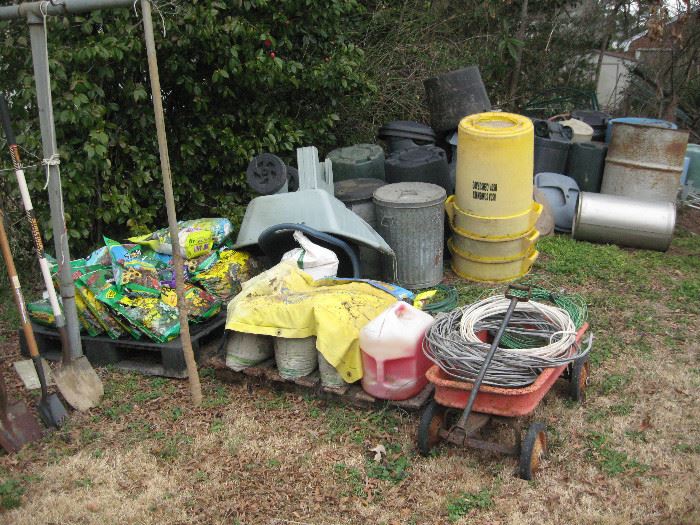 Potting soil, barrels and trash can galore.  Lots of multiple types of old wire.  Most of it appears to be telephone related.