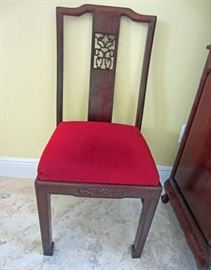 One of eight rosewood side chairs