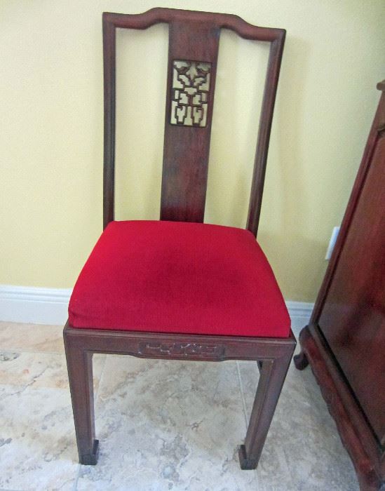 One of eight rosewood side chairs