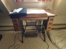 Early Singer Sewing Machine and attachments