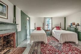 Pair of twin beds and fine oriental roomsize carpet