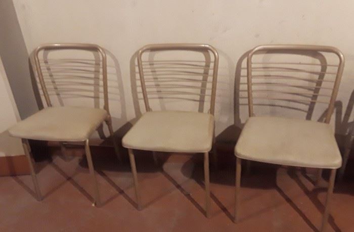 Set of 4 mid century card table chairs. They fold up nicely.  I have not come accross the table. 