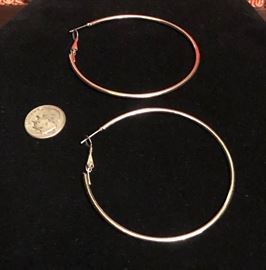 10 karat yellow gold hoop earrings. Large, dime pictured for size.