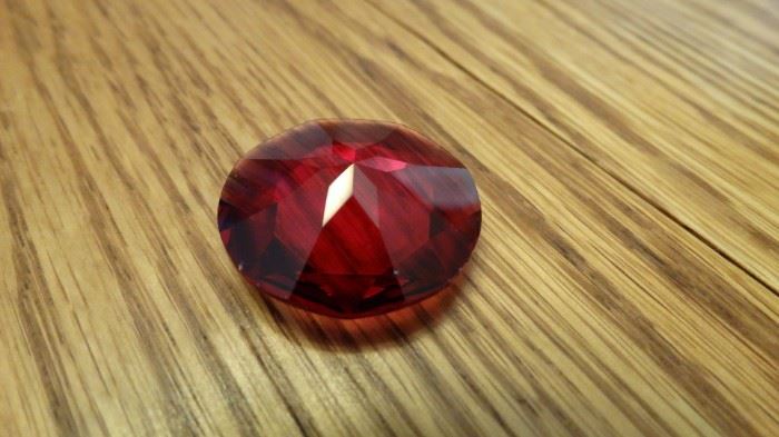 RED FACETED GEM