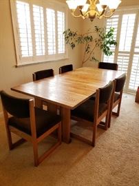 Mid-Century Mission Dining set. 6 chairs and a retractable leaf. Fantastic piece of furniture.