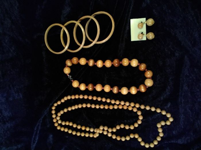 2 wooden bead necklaces, four wooden bracelets, one pair of clip on wooden earrings https://ctbids.com/#!/description/share/125110