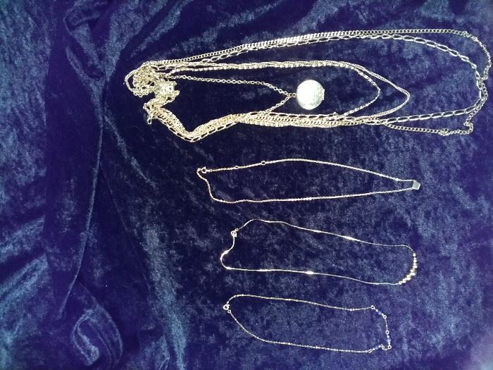 4 Gold style necklaces, one multi-strand, one blue stone, one gold bead, one gold Cube https://ctbids.com/#!/description/share/125113