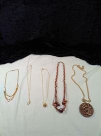 lot of 5 various necklaces; 1 paracord, one made in Hawaii amulet, 3 gold style pendant necklaces https://ctbids.com/#!/description/share/125141