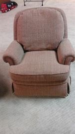 Jessica Charles  swivel, rocking arm chair.