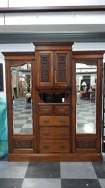 Beautiful antique hand carved mahogany triple combo wardrobe. 