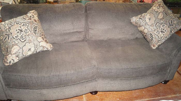 gray sofa with pillows