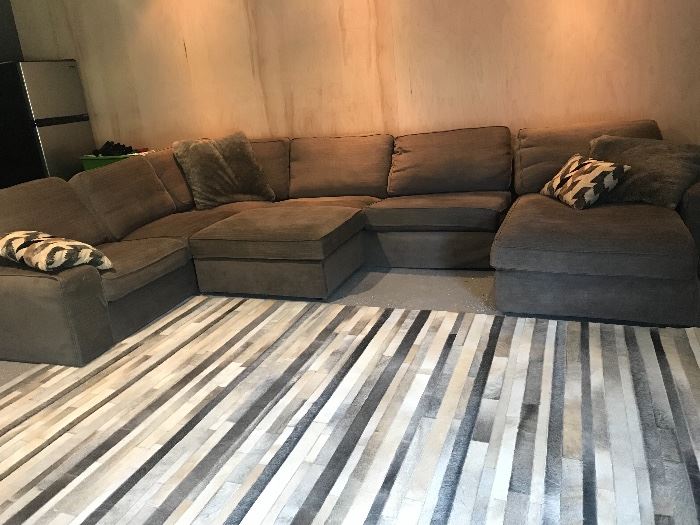 Gorgeous cowhide rug from crate and barrel 9 x 12
And Large sectional with storage ottoman. Removable and washable cushion covers!