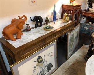 Sofa table with inlaid marble and elephant collection for those looking for luck