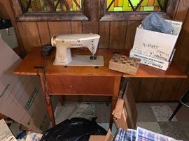 Vintage singer swing machine and table.  recently sold online for over $450