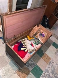 Vintage hope chest with vintage clothing and vintage knitting items. 