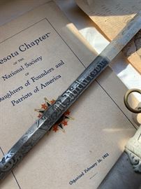 Minnesota chapter of the National Society of Daughters of Founders and Patriots of America  and sword. 