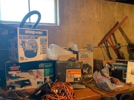 shop vac and vintage saw ans other items.
