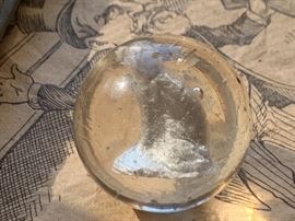 1895 marble with white dog inside 