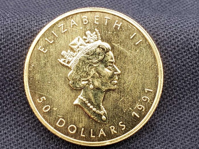 #13 1991 $50 Maple Leaf 1oz. Fine Gold Coin 1991 $50 Maple Leaf 1oz. Fine Gold Coin