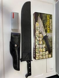 # 122 Three knives and a machete One is a buck knife Three knives and a machete