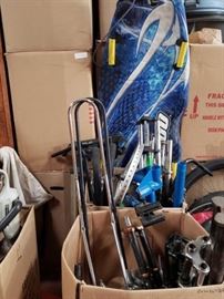 # 516 2 Boxes Of Miscellaneous Bike parts, Seats, Forks, Bike Stands and Snow Sled 2 Boxes Of Miscellaneous Bike parts, Seats, Forks, Bike Stands and Snow Sled