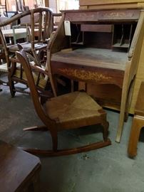 #706: Antquie secretary's desk and wicker rocking chair
Secretary's desk measure 42" tall 28" wide and approximately 18" deep