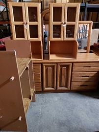 # 715 Approximately 6 Peices of Miscellaneous Furniture Shelving mears dressers and cabinets all for one money