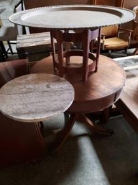 #726: 2 Antique Asian Tables
The larger of the 2 tables measures 28" tall and 30" around the smaller Measures 16" tall You can place every removable granite top or you can place a removable brass top