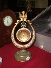 FRENCH 3" DIAMETER CRYSTAL BALL WATCH/CLOCK SUSPENDED IN A DORE' BRONZE ENAMELED STAND HELD IN THE BEAK OF A BIRD ON AN ONYX PLATFORM. TREMENDOUS!!
