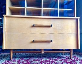 Closer look at the bottom portion of the china cabinet, showing the 2-toned accents