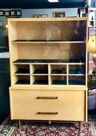 MID-CENTURY MODERN 1960's era,&nbsp;designed by&nbsp;Merton Gershun, titled&nbsp;"URBAN SUBURBAN," by American of Martinsville Co. There are two matching pieces and  these are extremely&nbsp;rare. Each piece has its&nbsp;original label&nbsp;still attached. The&nbsp;two-toned, all original,&nbsp;solid wooden accents are simple, yet elegant&nbsp;in design, making these very sought after by&nbsp;the Mid-Century Modern lovers and collectors.&nbsp;
Dimensions of the China Cabinet: 59" height, 41" width, 15" depth&nbsp;
Dimensions of the small Buffet: 30" height, 36" width, 19" depth