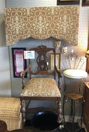 Antique upholstered chair with a matching vintage upholstered cornice board