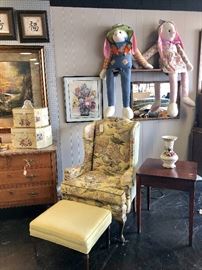 Yellow upholstered chair and ottoman, with mahogany vintage table with a top that turns 
