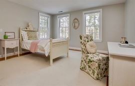 Another French Provincial twin bed, white night stand, white desk and slip-covered chair.