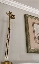 Neat, tall brass sculptures of musicians