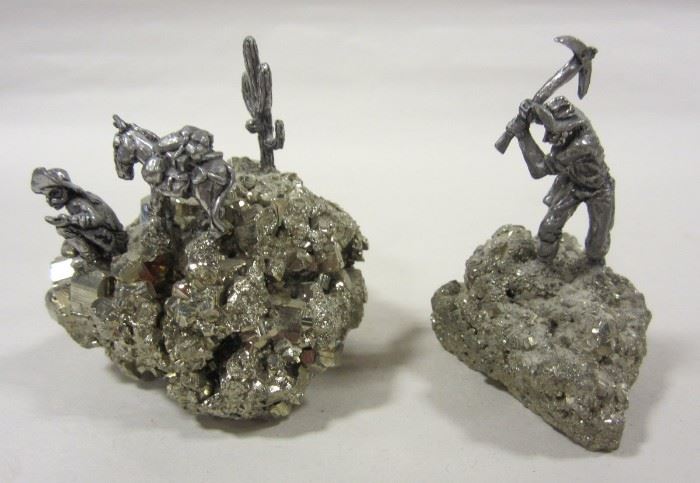 TWO PEWTER SCULPTURES OF MINORS MOUNTED ON PYRITE