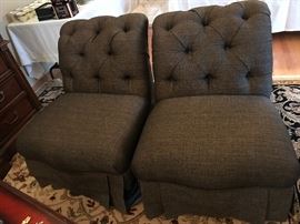 Pair of cafe au lait colored swivel slipper chairs