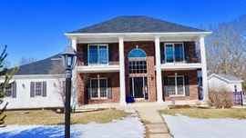 A wonderful home with an attached home on Grand River plus a pool.