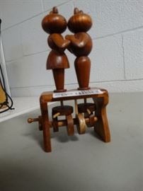 Wood carved dancing cats