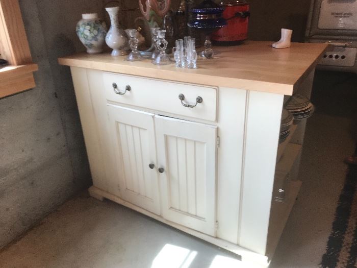 large Kitchen Island with butcher block top and tons of storage